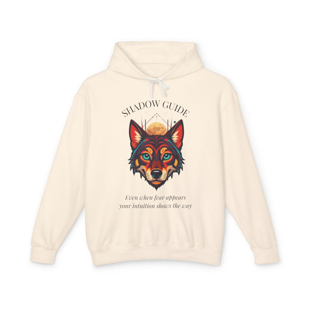 Cream hoodie with vibrant multicolored wolf head graphic, intense eyes in orange blue teal splashes, full moon above, "SHADOW GUIDE" arched text, motivational quote "Even when fear appears, your intuition shows the way" below