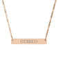 Rose gold bar necklace with engraved uppercase text "GUIDED" on a sleek matte pendant, suspended on a delicate matching rose gold chain. Minimalist motivational affirmation jewelry for guidance, intuition, and spiritual alignment.