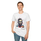 White unisex cotton t-shirt modeled by smiling man with short brown hair, hand in pocket, featuring bold "Primal" graphic on chest: stylized intense male portrait with stylish hair, vibrant multicolored geometric face in red, orange, teal, blue and gold tones, dynamic paint splatters and abstract shards exploding outward. Elegant white cursive "Primal" text below. Primal masculine energy motivational crewneck tee.