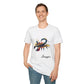 White unisex cotton t-shirt modeled by smiling man with short brown hair, featuring bold Scorpio zodiac graphic on chest: vibrant abstract scorpion silhouette with raised stinger, intense glowing eyes, detailed tail and pincers, geometric patterns, and explosive multicolored paint splatters in gold, red, navy, teal, and black tones bursting outward. Elegant black cursive "Scorpio" text below. Astrology zodiac motivational crewneck tee.