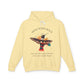 Yellow hoodie with 'Move With Grace' inspirational hummingbird graphic and quote 'Even when the world accelerates, Your center remains steady' printed on the front.