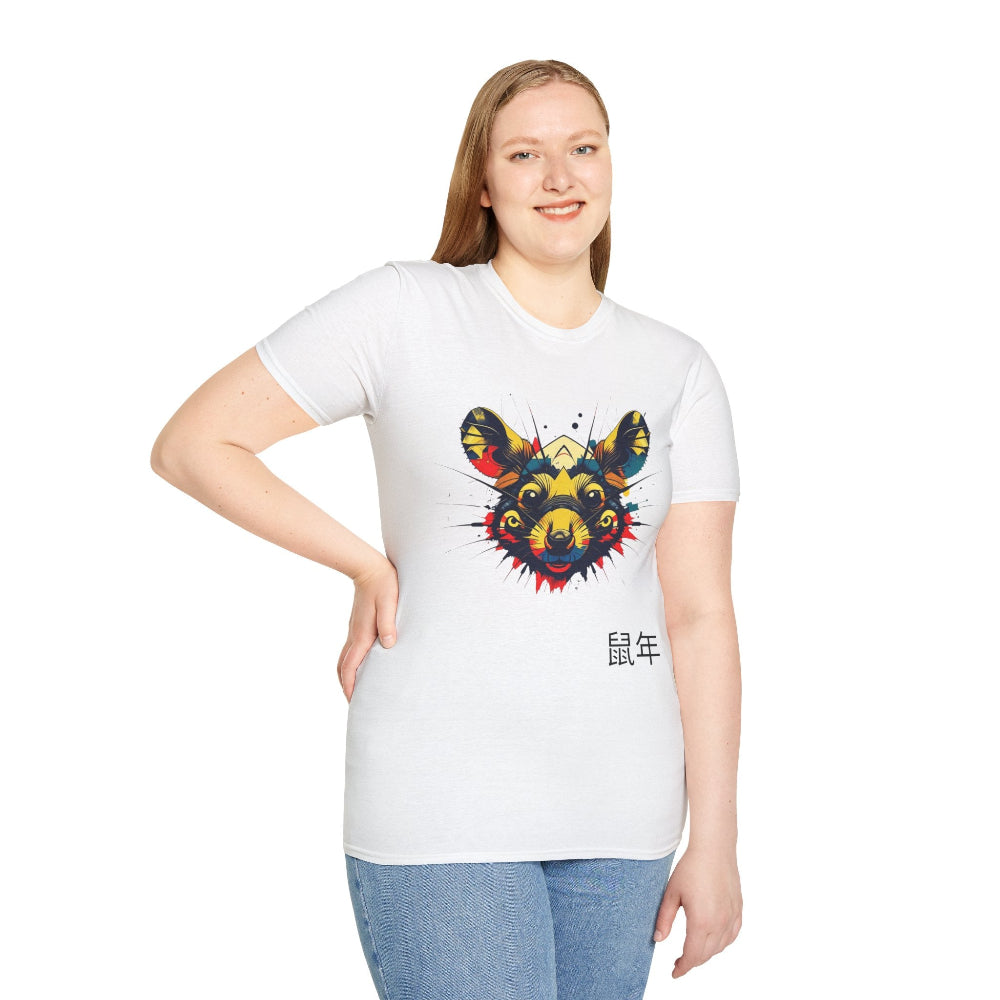 White unisex cotton t-shirt modeled by smiling plus-size female with long brown hair, hands on hips, featuring bold colorful rat face graphic: vibrant abstract rat portrait with large ears, intense eyes, geometric patterns, and multicolored paint splatters in yellow, red, blue, teal, and orange. Chinese text "鼠年" (Year of the Rat) printed below in black. Zodiac Year of the Rat motivational crewneck tee.