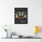 Black canvas wall art print of colorful abstract Gemini twin faces with butterfly wings and cosmic splatters on dark background, featuring "Gemini" in elegant white cursive  displayed in a modern home décor setting above a console table with books and yellow lamp.