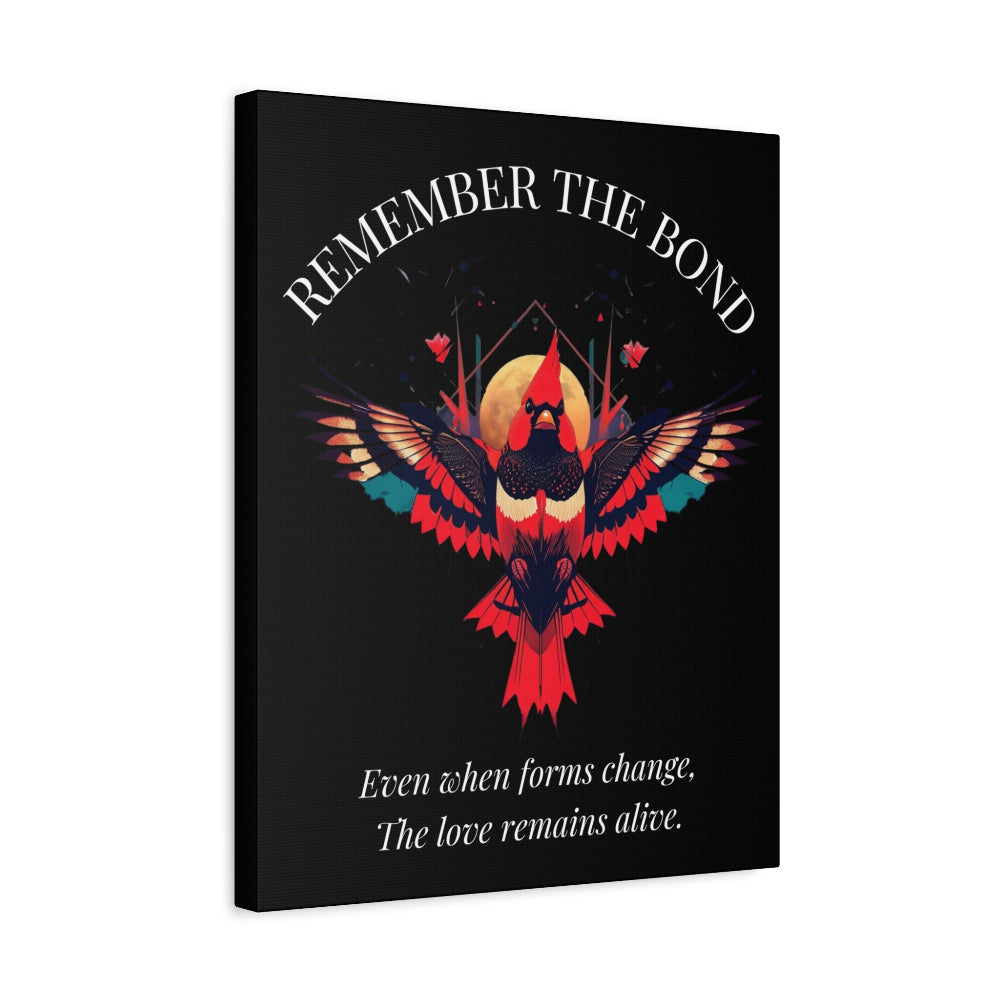 Canvas wall art print on black background featuring a vibrant, colorful cardinal bird with outstretched wings. Text reads "REMEMBER THE BOND" at the top and "Even when forms change, The love remains alive." below. Spiritual and motivational home decor.