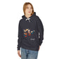 Young woman with long hair modeling charcoal gray hoodie featuring vibrant artistic portrait of a fierce woman with long flowing hair, bold colorful makeup, multicolored splash effects, geometric sun backdrop, "Feral" text below