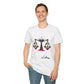 White unisex cotton t-shirt modeled by smiling man with short brown hair, featuring bold Libra zodiac graphic on chest: vibrant abstract scales of justice with balanced arms, intricate geometric triangular motifs, central axis design, symmetrical layout, and dynamic multicolored paint splatters in gold, red, navy, teal, and black tones bursting outward. Elegant black cursive "Libra" text below. Astrology zodiac motivational crewneck tee.