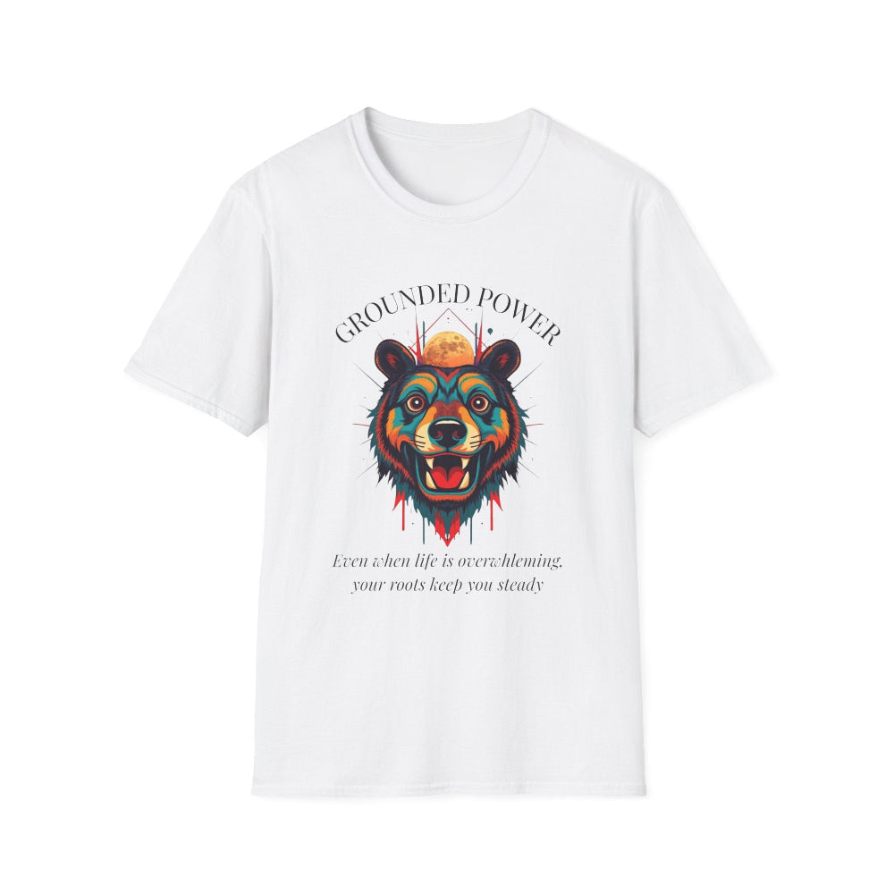 White unisex cotton t-shirt featuring bold "Grounded Power" graphic: vibrant abstract bear head portrait with intense expression, colorful geometric accents, and dynamic paint splatters in red, orange, teal, blue, and gold tones bursting outward around an orange moon background. Arched white text "GROUNDED POWER" above and smaller inspirational quote "Even when life is overwhelming, your roots keep you steady" below. Motivational spiritual empowerment crewneck tee.