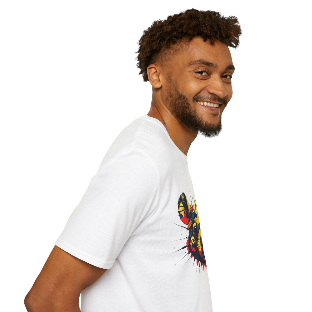 White unisex cotton t-shirt in side profile on smiling male model with curly hair and beard, featuring bold colorful rat face graphic on chest: vibrant abstract rat portrait with large ears, intense eyes, geometric patterns, and multicolored paint splatters in yellow, red, blue, teal, and orange. Chinese text "鼠年" (Year of the Rat) printed below in black. Zodiac Year of the Rat motivational crewneck tee.