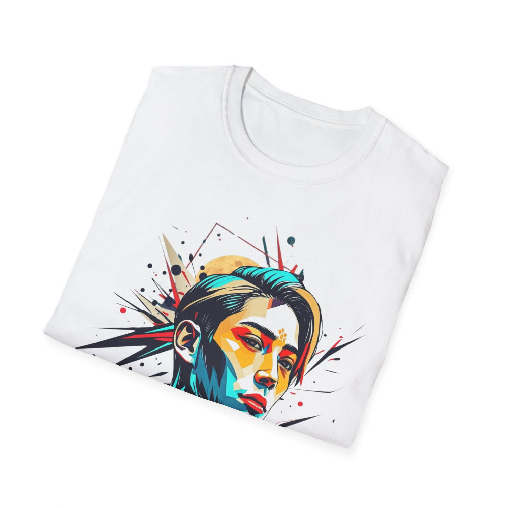 White folded unisex cotton t-shirt featuring bold abstract graphic print: stylized intense male portrait with vibrant multicolored face in teal, yellow, red, and black geometric shards, dynamic paint splatters, and explosive lines bursting outward. Primal energy motivational crewneck tee.