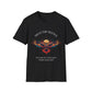 Black unisex cotton t-shirt featuring bold "Trust the Silence" graphic: vibrant abstract owl with detailed feathers, intense expression, colorful geometric accents, and dynamic paint splatters in red, orange, teal, blue, and gold tones bursting outward around an orange moon background. Arched white text "TRUST THE SILENCE" above and smaller inspirational quote "Even when the world is quiet, wisdom speaks softly" below. Motivational spiritual empowerment crewneck tee.