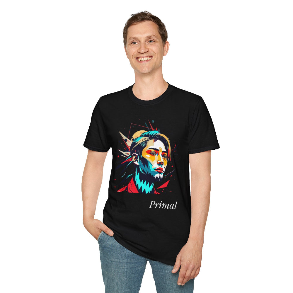 Black unisex cotton t-shirt modeled by smiling man with hand in pocket, featuring bold "Primal" graphic: stylized intense bearded man portrait with vibrant multicolored face in red, yellow, teal, and blue geometric shards and dynamic paint splatters exploding outward. Elegant white cursive "Primal" text below. Primal masculine energy motivational crewneck tee.