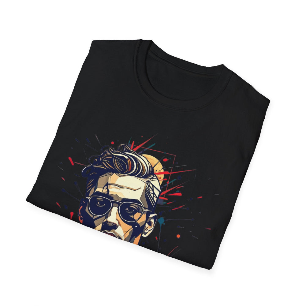 Black folded unisex cotton t-shirt featuring bold Primal graphic: stylized cool man portrait with sunglasses, stylish hair, intense expression, vibrant red, blue, yellow paint splatters bursting outward. Primal masculine energy motivational crewneck tee.