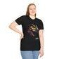 Black unisex cotton t-shirt modeled by smiling plus-size female with long blonde hair, hand on hip, featuring bold Year of the Dragon graphic: vibrant abstract dragon head portrait with fierce open mouth, sharp golden horns, intricate scales, flowing mane, and dynamic multicolored paint splatters in gold, red, black, blue, teal, and orange tones exploding outward. Chinese text "龙年" (Year of the Dragon) printed below in white. Zodiac Chinese New Year motivational crewneck tee.