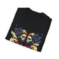 Black folded unisex cotton t-shirt featuring bold Gemini zodiac graphic print: vibrant abstract twin female faces with flowing hair, intense expressions, geometric patterns, and dynamic multicolored paint splatters in gold, red, navy, teal, and black tones exploding outward to form butterfly wings. Elegant white cursive "Gemini" text below. Astrology zodiac motivational crewneck tee.