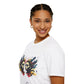 White unisex cotton t-shirt in side profile on smiling woman with braided hair, featuring bold Gemini zodiac graphic on chest: vibrant abstract twin female faces with flowing hair, intense expressions, geometric patterns, and dynamic multicolored paint splatters in gold, red, navy, teal, and black tones exploding outward. Elegant black cursive "Gemini" text below. Astrology zodiac motivational crewneck tee.