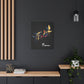 Black canvas wall art print of colorful abstract mirrored fish with flowing fins and cosmic splatters on dark background, featuring "Pisces" in elegant white cursive hung on a dark grey wall above a wooden shelf with potted plants.