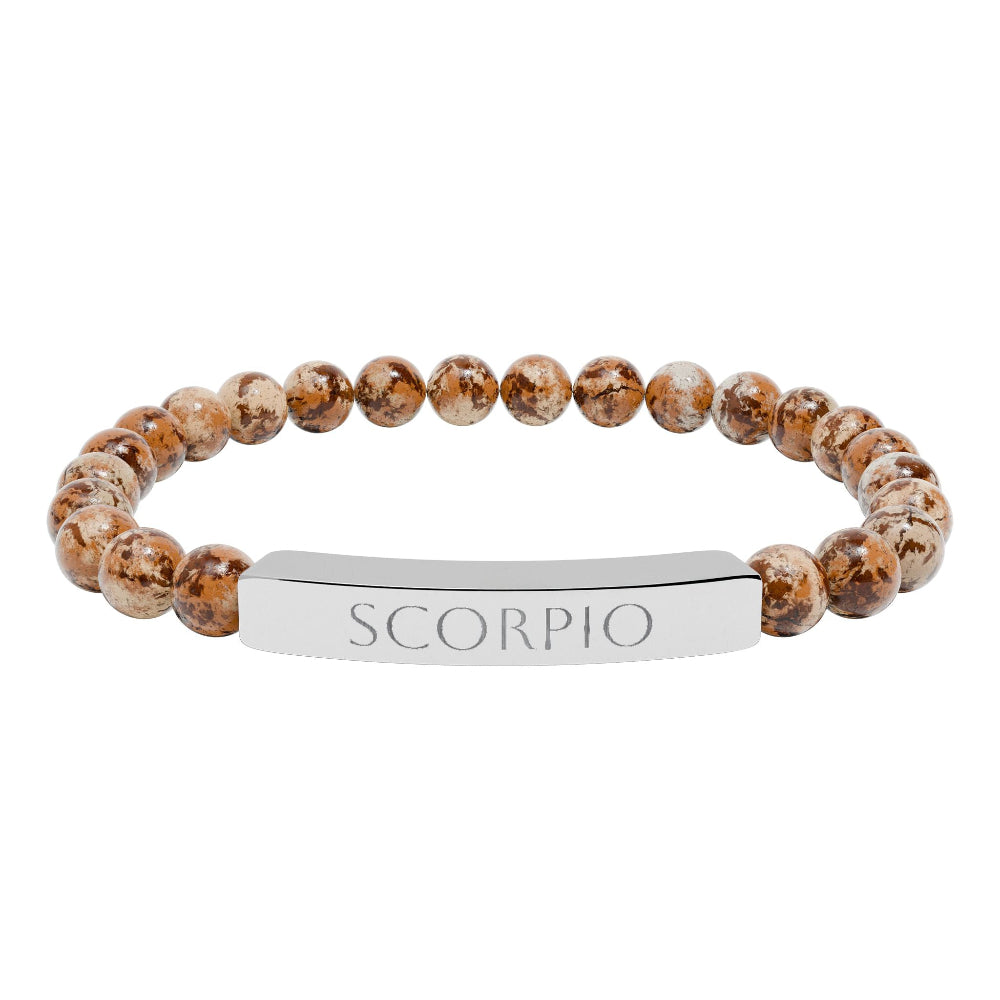 Bracelet with polished leopard jasper beads in earthy brown tones with natural veining, featuring a silver curved bar engraved "SCORPIO" in uppercase letters. Stretch-fit zodiac-inspired crystal jewelry for intensity, transformation, and emotional depth.