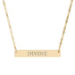 Gold bar necklace featuring engraved uppercase text "DIVINE" on a sleek matte gold pendant, suspended on a delicate matching gold chain. Minimalist spiritual affirmation jewelry for empowerment and divine connection.