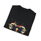 Black folded unisex cotton t-shirt featuring bold Capricorn zodiac graphic print: vibrant abstract goat/ram head portrait with large curved horns, intense glowing eyes, geometric diamond accents, flowing beard details, and dynamic multicolored paint splatters in gold, red, navy, teal, and black tones exploding outward. Elegant white cursive "Capricorn" text below. Astrology zodiac motivational crewneck tee.