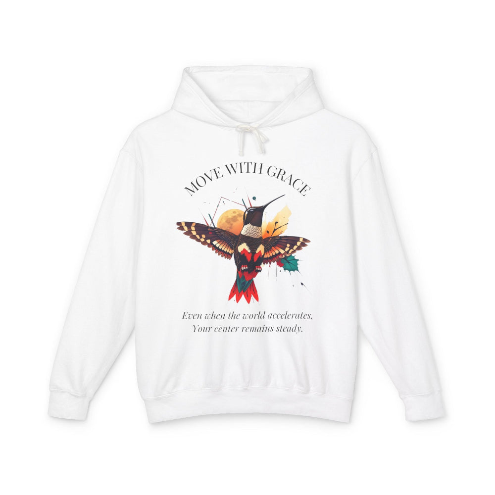 White hoodie with 'Move With Grace' inspirational hummingbird graphic and quote 'Even when the world accelerates, Your center remains steady' printed on the front.