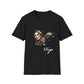 Black unisex cotton t-shirt featuring bold Virgo zodiac graphic: vibrant abstract woman holding wheat sheaf, serene expression, flowing hair with headscarf, detailed feathers, geometric accents, and dynamic multicolored paint splatters in gold, red, navy, teal, and black tones bursting outward. Elegant white cursive "Virgo" text below. Astrology zodiac motivational crewneck tee.