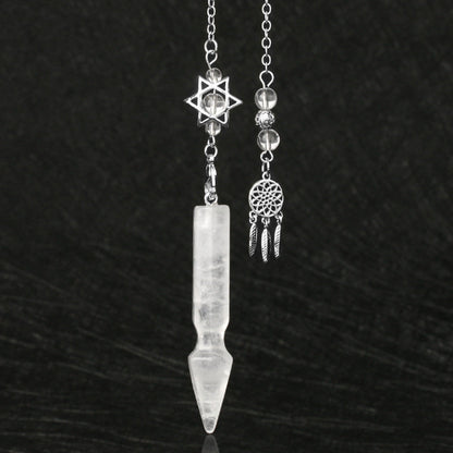 Silver pendulum with a long clear quartz crystal point, featuring a Star of David charm with clear quartz beads above. Beside it is a matching silver dreamcatcher charm with clear quartz beads and feather details. Crystal dowsing tool set.