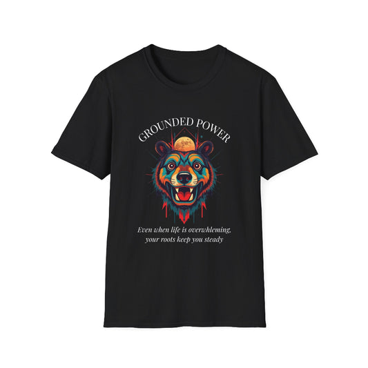 Black unisex cotton t-shirt featuring bold "Grounded Power" graphic: vibrant abstract bear head portrait with intense expression, colorful geometric accents, and dynamic paint splatters in red, orange, teal, blue, and gold tones bursting outward around an orange moon background. Arched white text "GROUNDED POWER" above and smaller inspirational quote "Even when life is overwhelming, your roots keep you steady" below. Motivational spiritual empowerment crewneck tee.