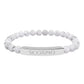 Bracelet with polished white howlite beads featuring natural gray-black veining and marbling, paired with a silver curved bar engraved "SCORPIO" in uppercase letters. Stretch-fit zodiac-inspired crystal jewelry for intensity, transformation, and emotional depth.