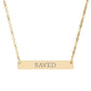 Gold bar necklace with engraved uppercase text "SAVED" on a sleek matte pendant, suspended on a delicate matching gold chain. Minimalist motivational affirmation jewelry for grace, redemption, and spiritual protection.